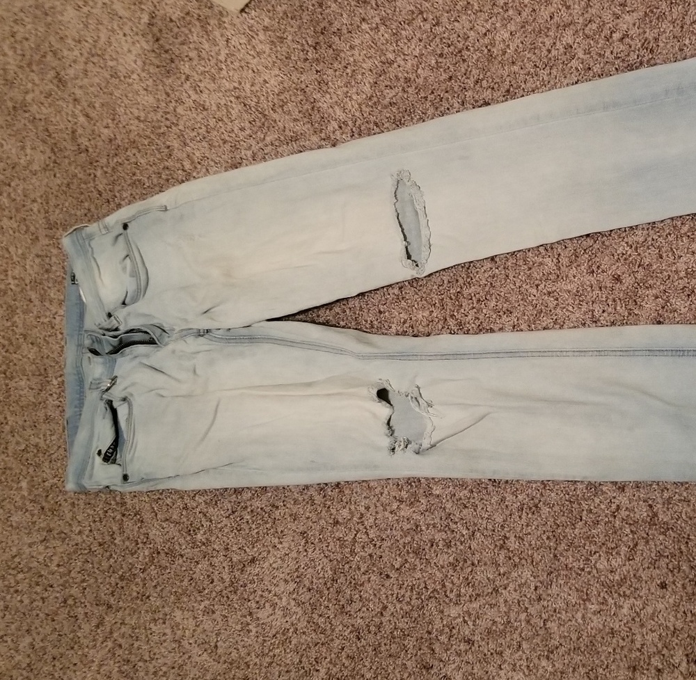 Ripped light blue jeans.. skinny